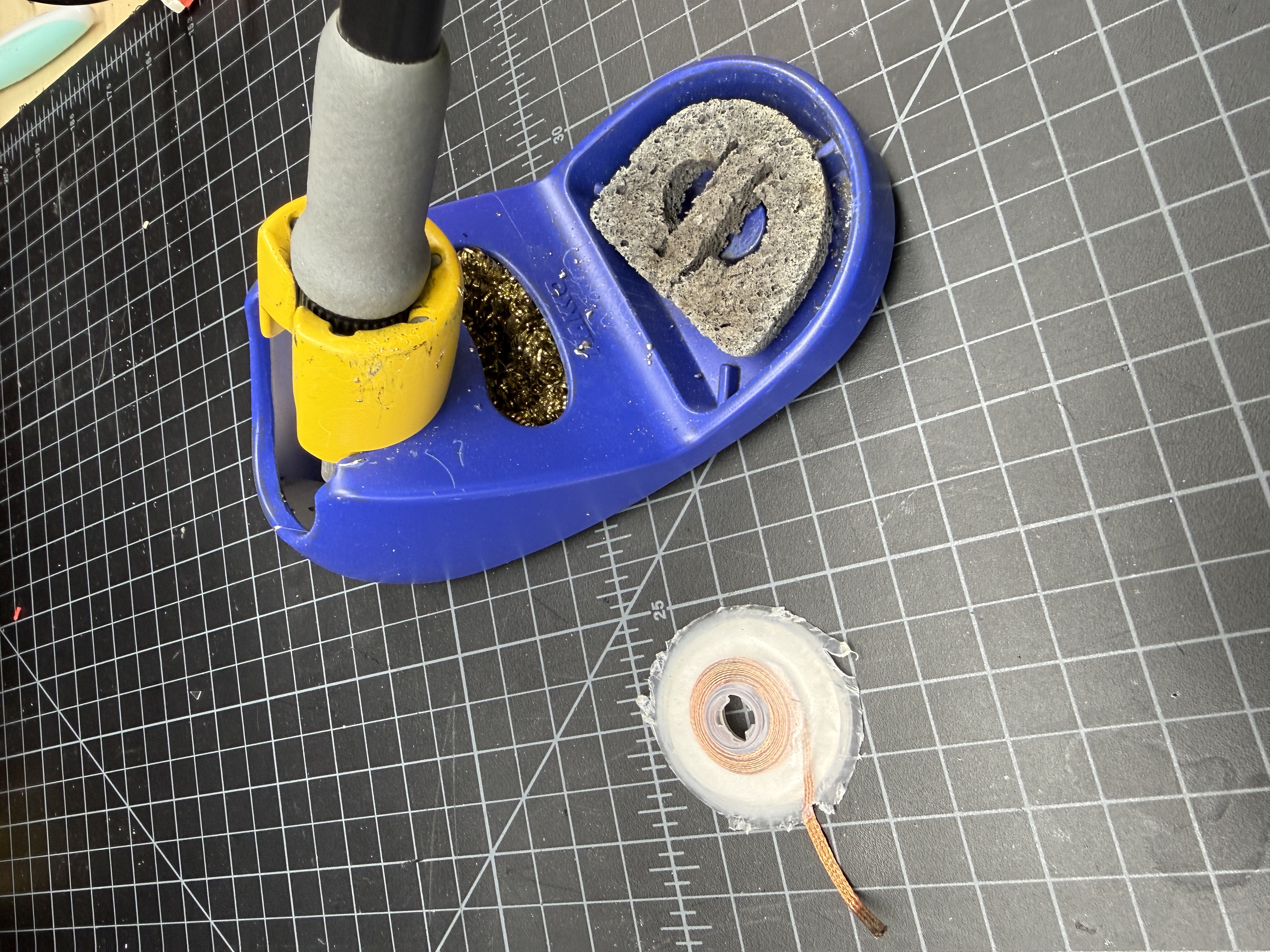 A roll of copper desoldering braid on the bench