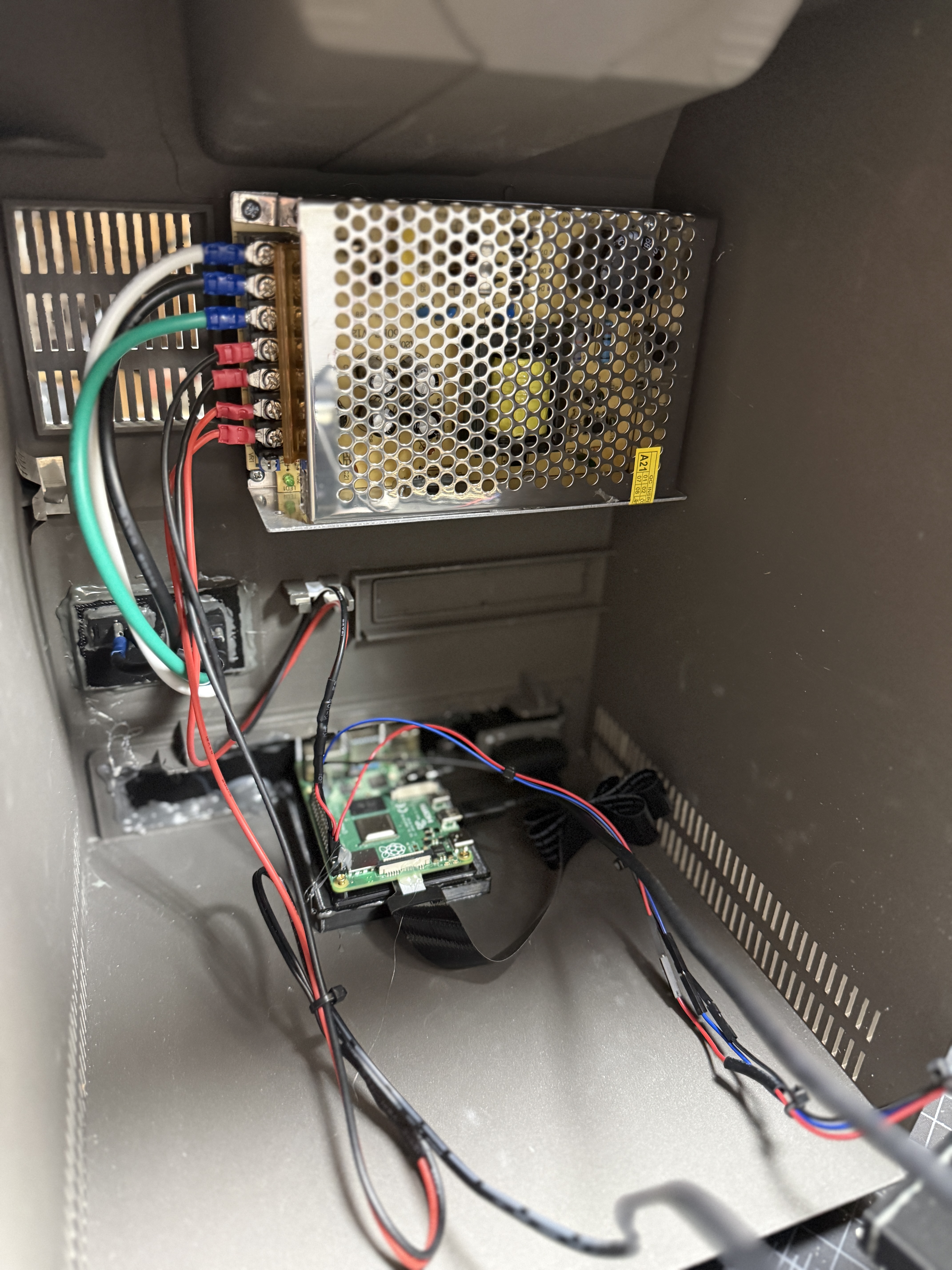 Internal view showing the Raspberry Pi and DC power supply mounted inside the SE/30 case